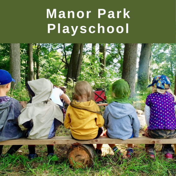 Children sitting in forest setting - Manor Park Playschool